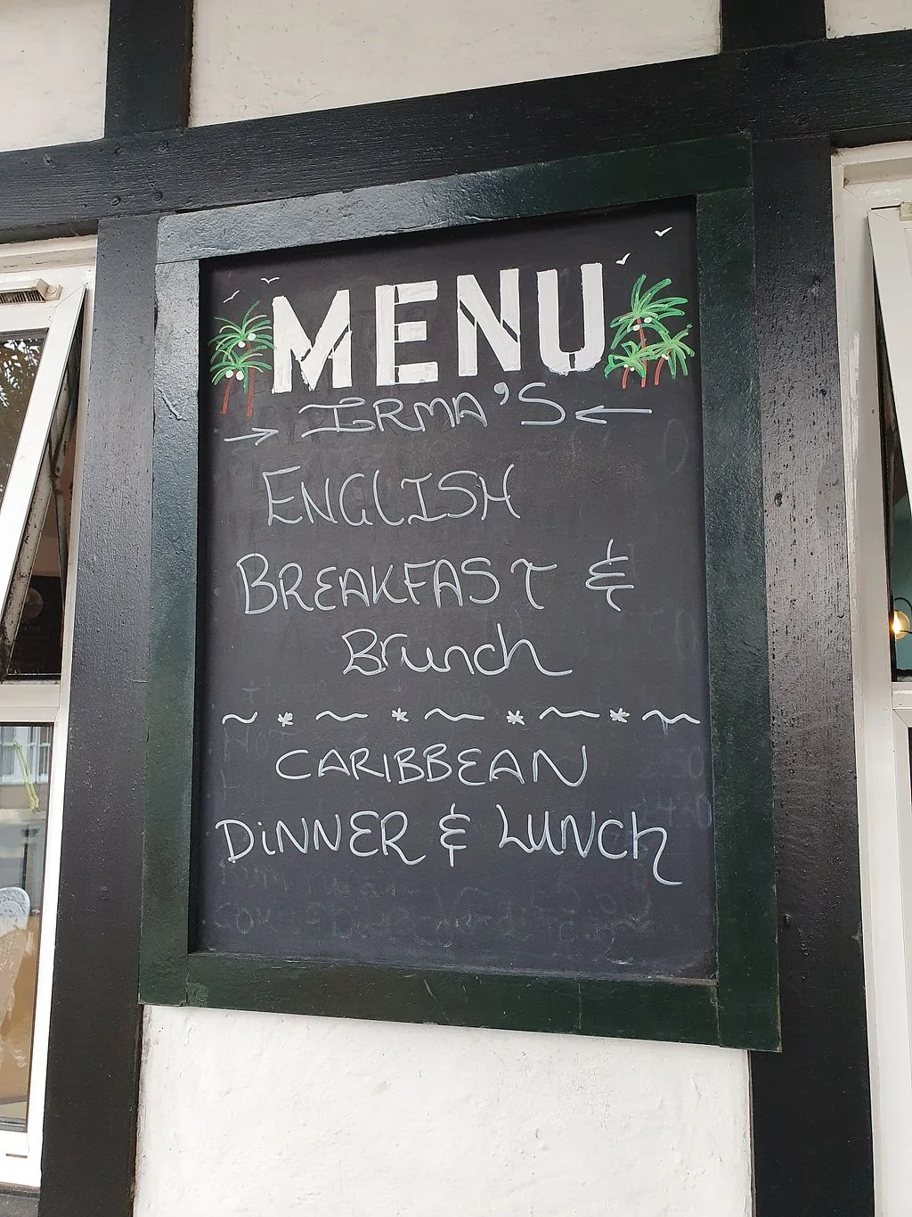 Irma's chalkboard describing English breakfast, brunch and Caribbean lunch and dinner
